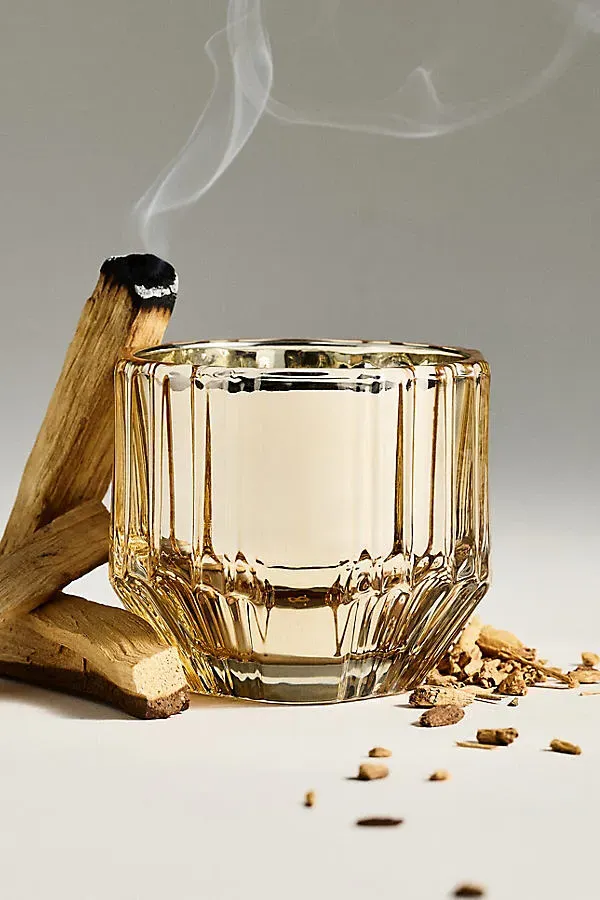 Sabina Woody Palo Santo & Tonka Medium Glass Candle - Gold by Anthropologie