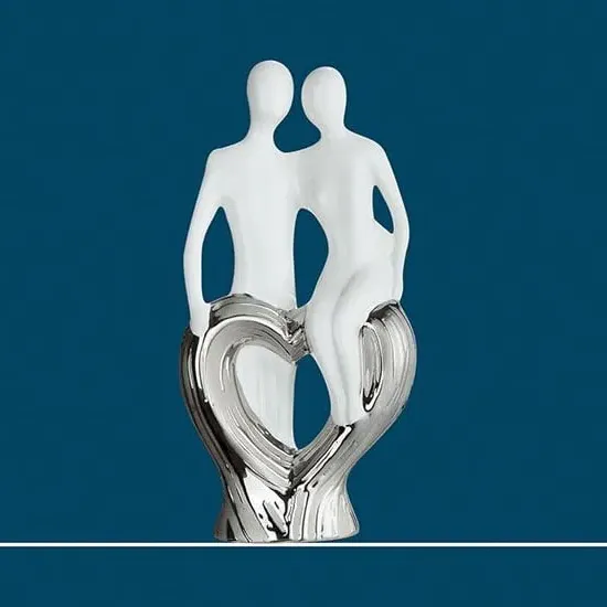 Moline Ceramics Couple Sitting On Heart Sculpture - White