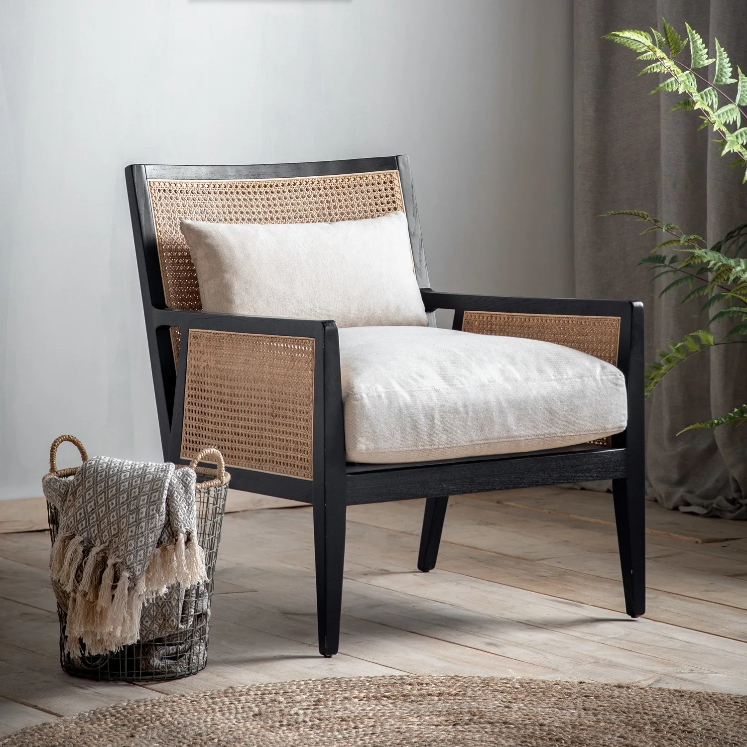 cream-rattan-chair-with-cushions-and-black-wood-frame-caspian-house image