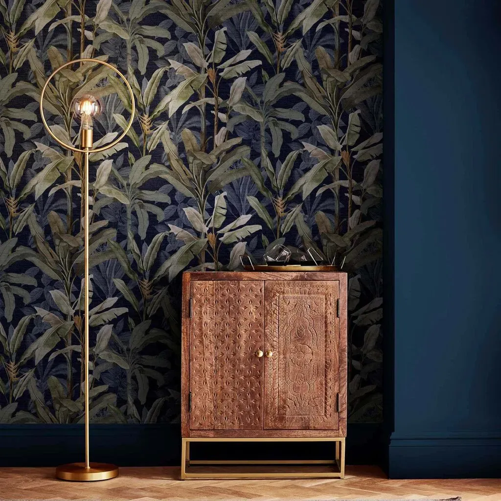 graham-brown-borneo-midnight-wallpaper-blue-leaves-wallpaper-we-are-carbon-neutral image