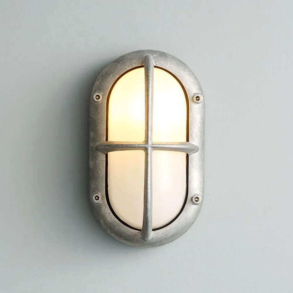 Small Oval Bulkhead Light with Guard - Weathered Brass