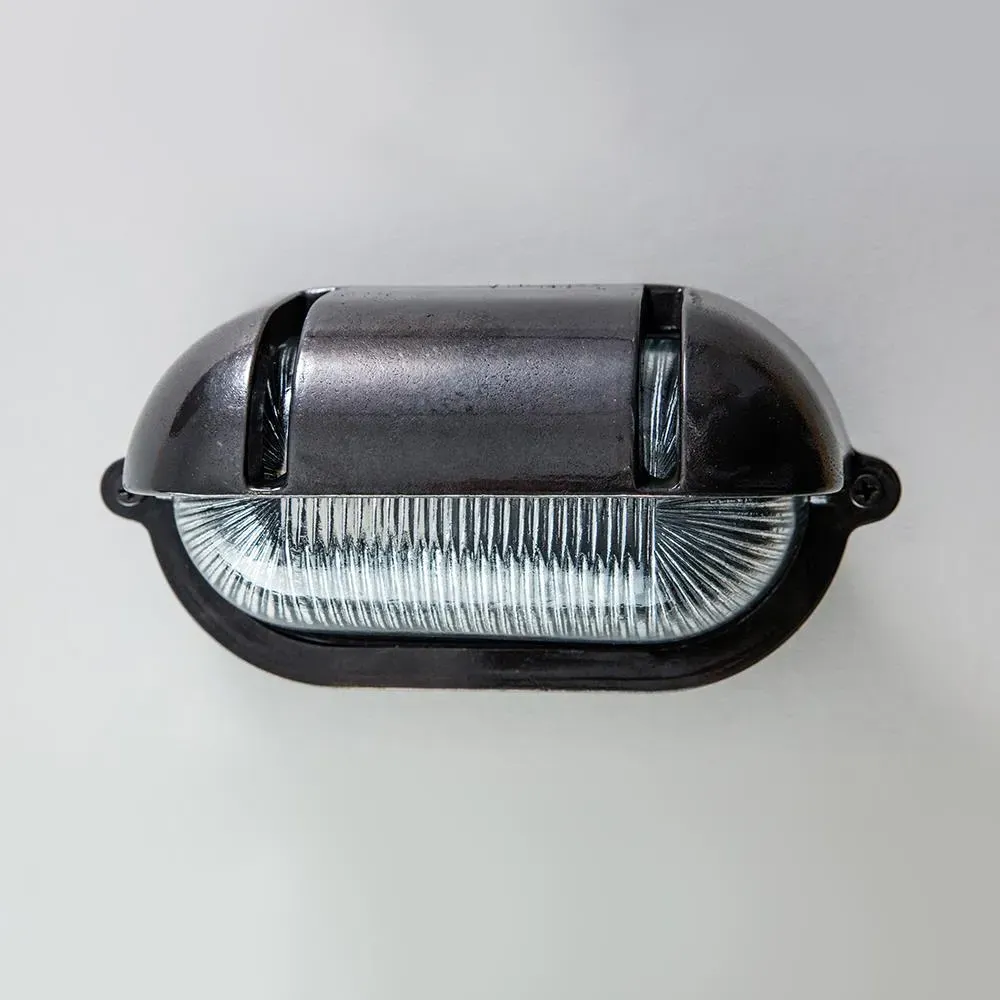 Oval Bulkhead Light with Eyelid - Antique Brass