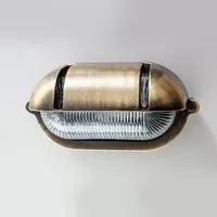 Oval Bulkhead Light with Eyelid - Antique Brass