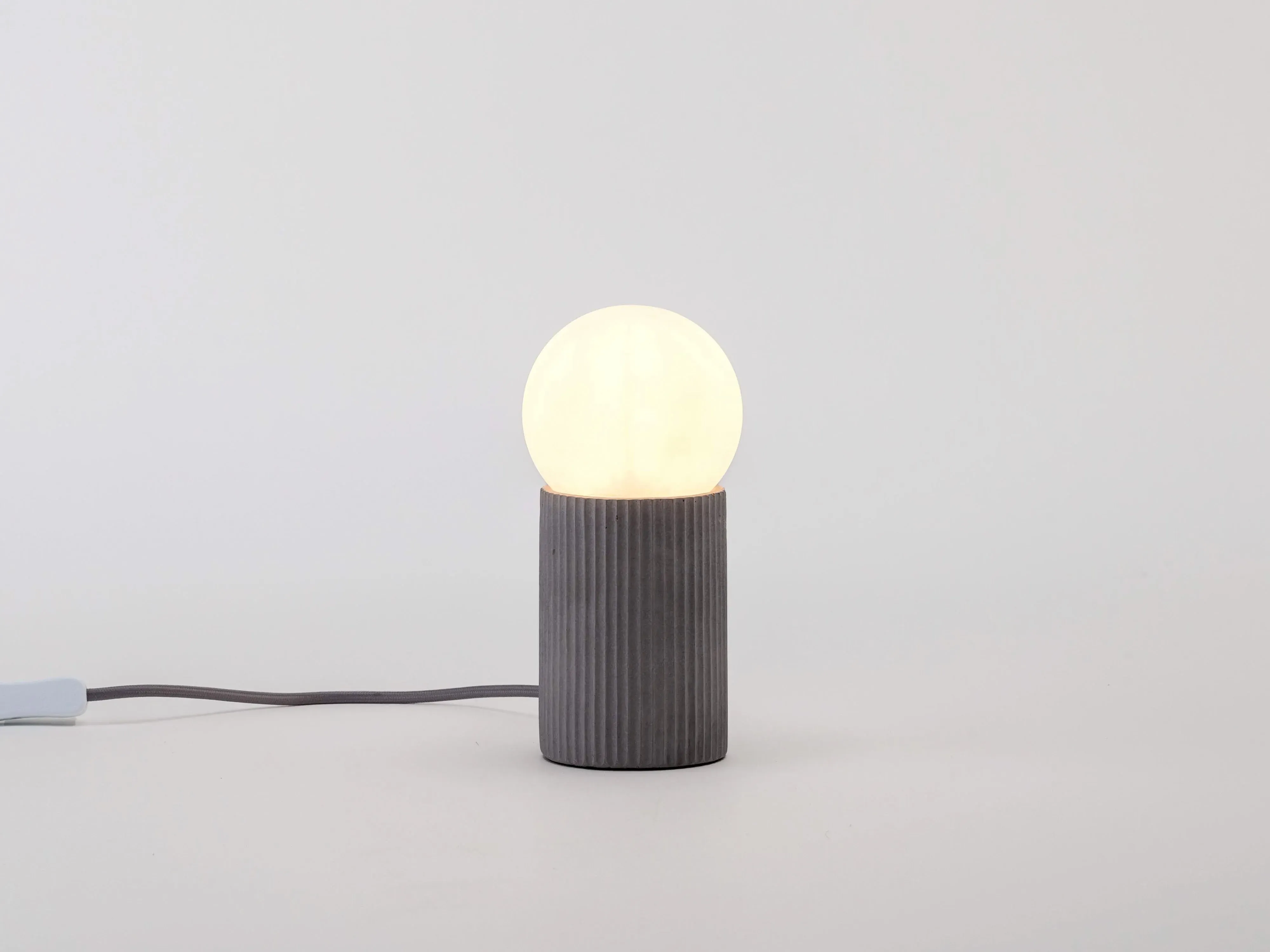 grey-concrete-ribbed-table-lamp image