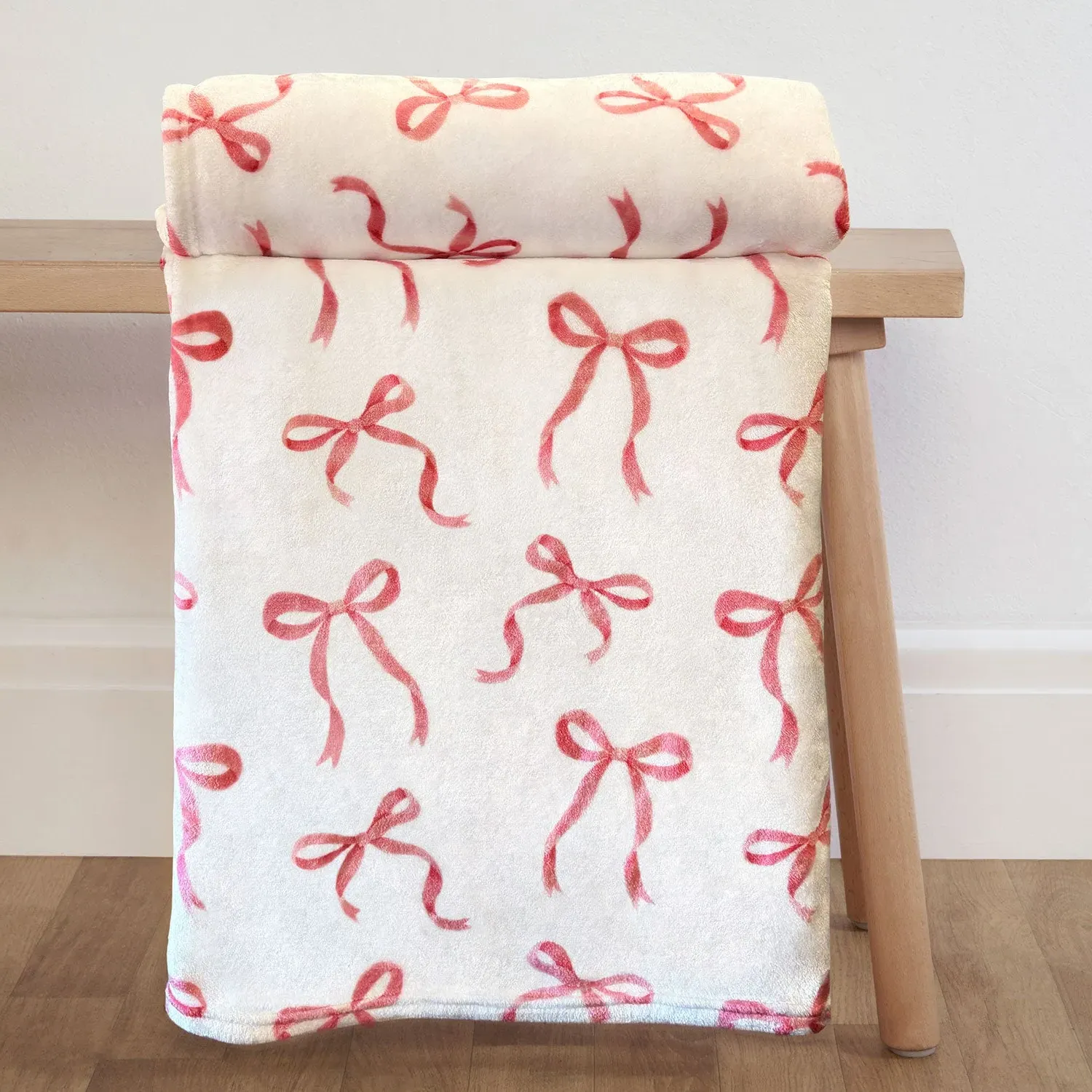 Bows Printed Fleece Throw - Pink, White by Julian Charles