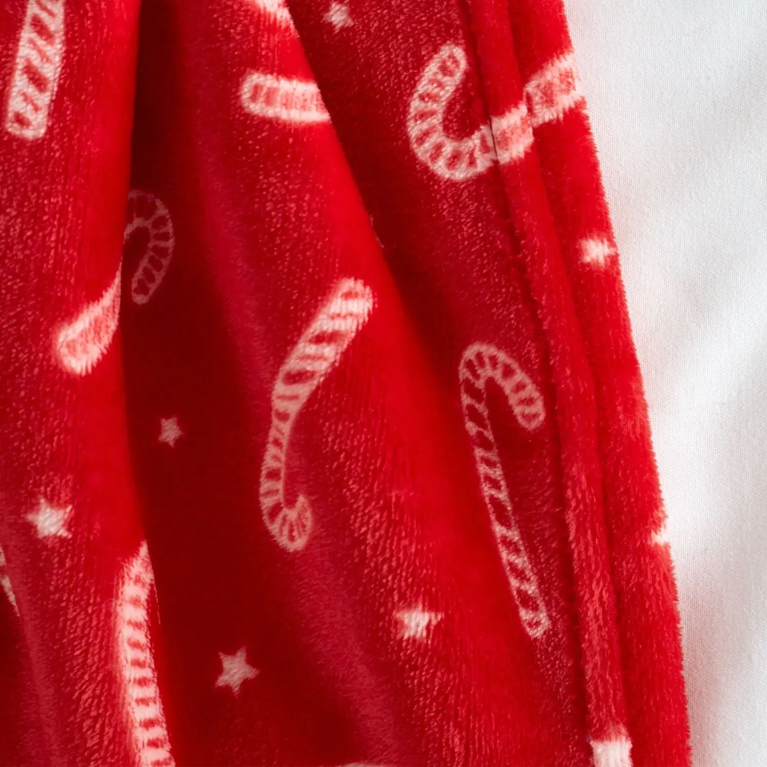 Catherine Lansfield Christmas Candy Cane Fleece Throw - Red by Julian Charles, alternate view