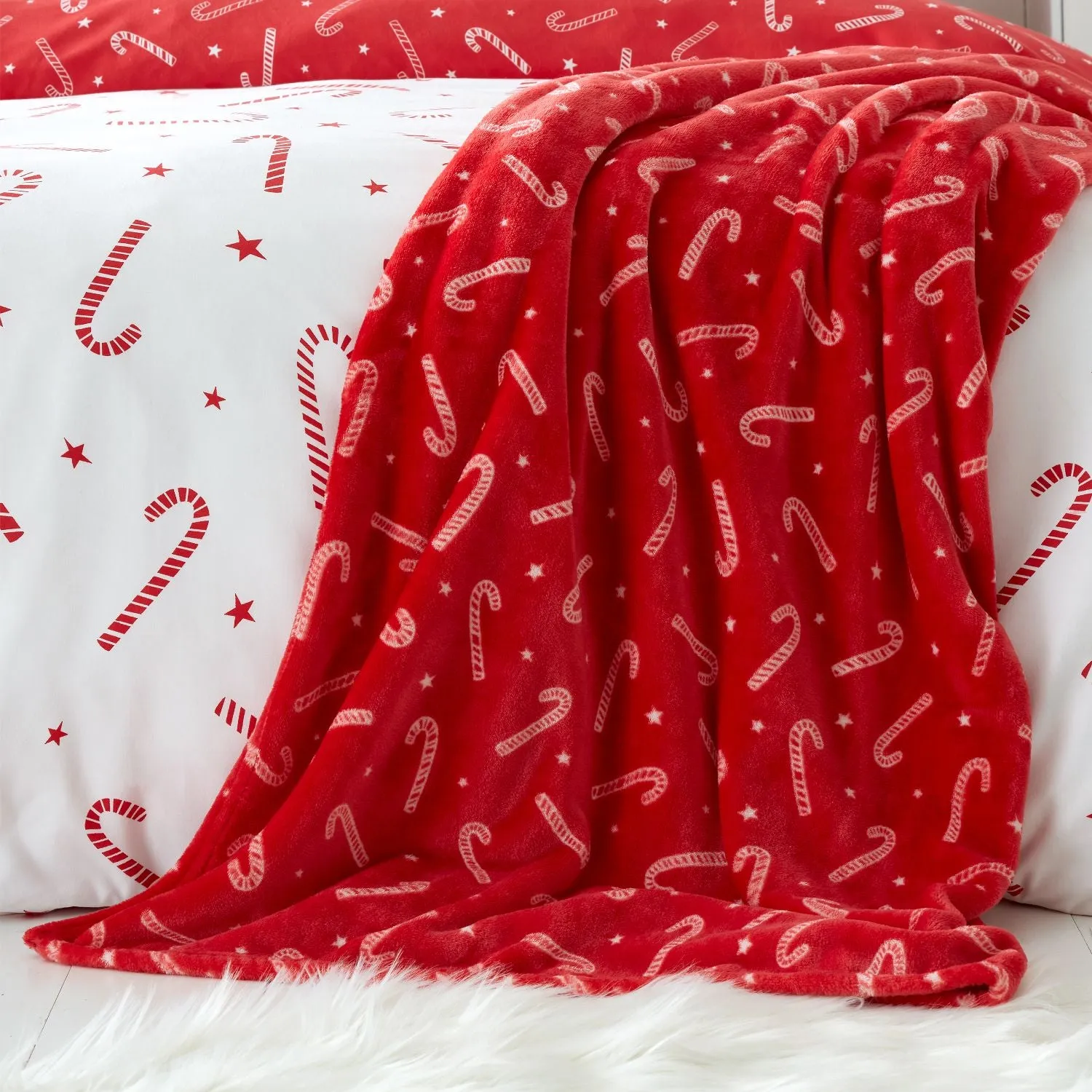 Catherine Lansfield Christmas Candy Cane Fleece Throw - Red by Julian Charles