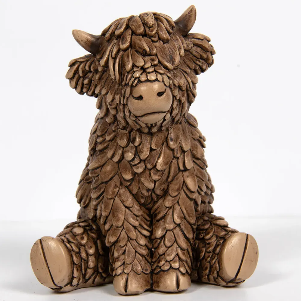 Hughie Highland Cow Sitting Small Ornament by Julian Charles