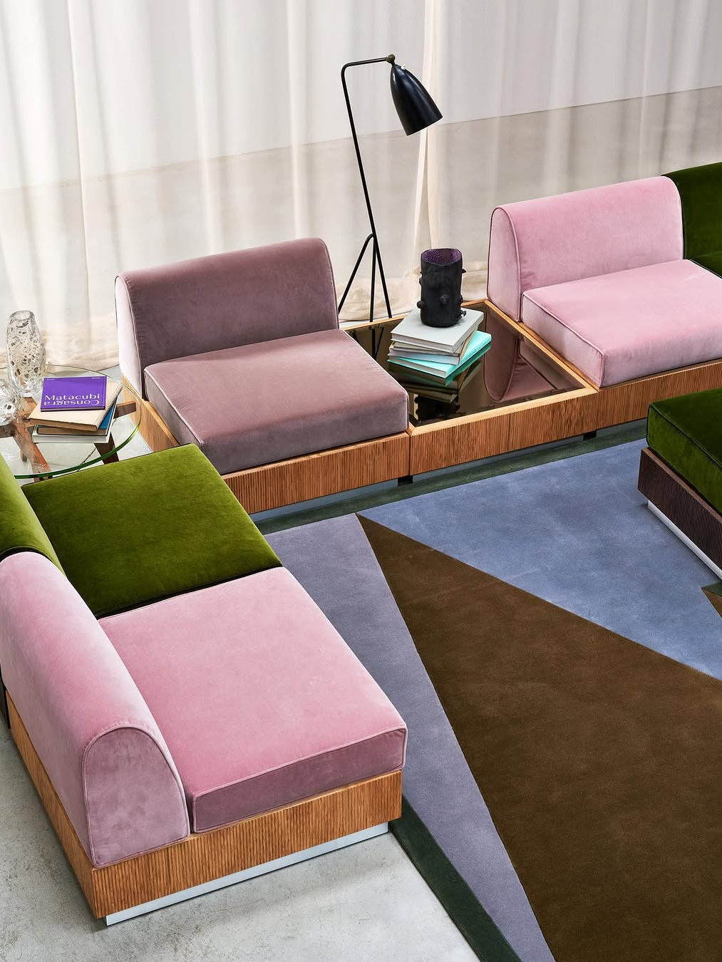 Sculptural modular sofa with colour block velvet seating, clean lines and geometric layout reflecting modern interior design trends 2026