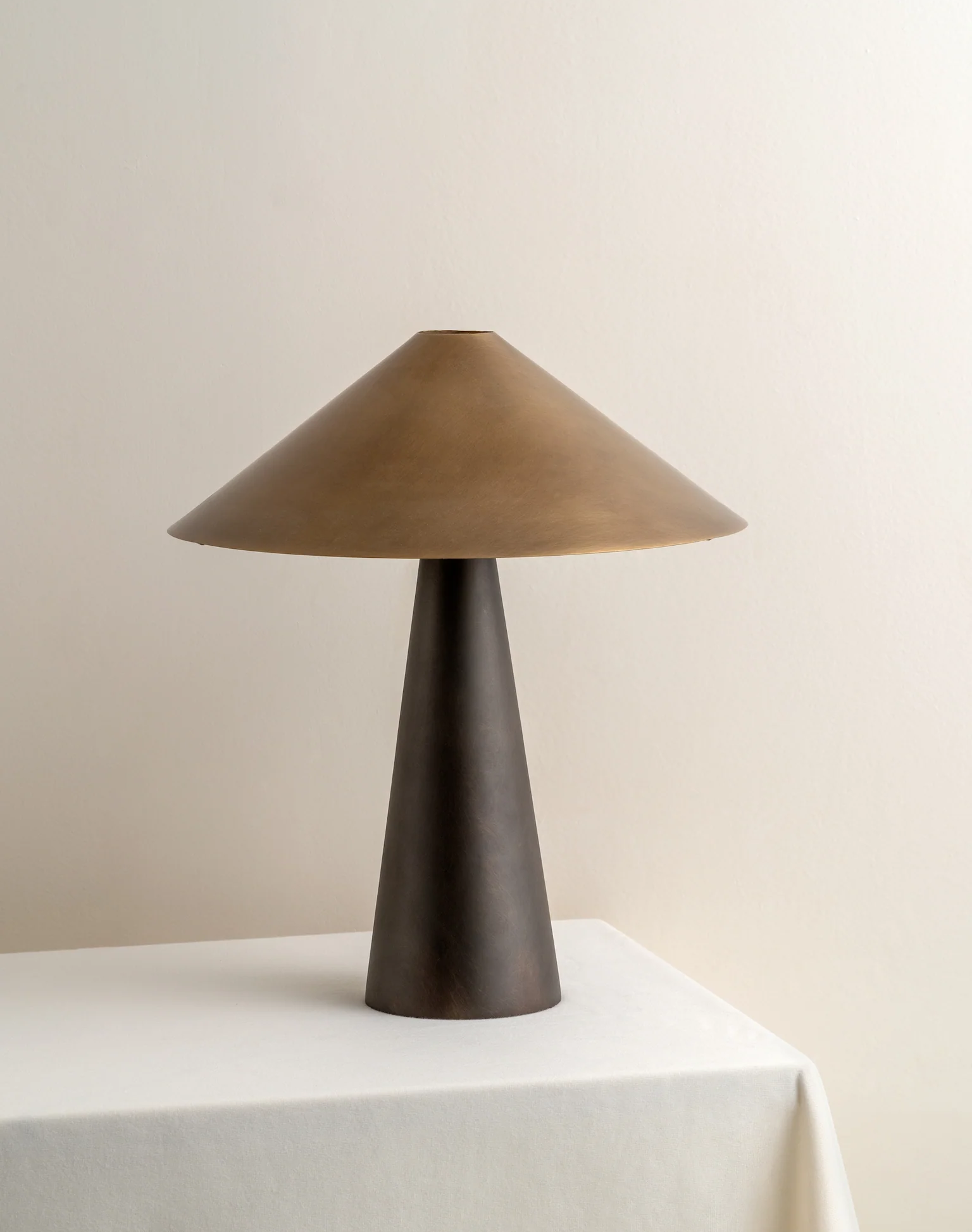 Orta - aged brass and bronze cone table lamp