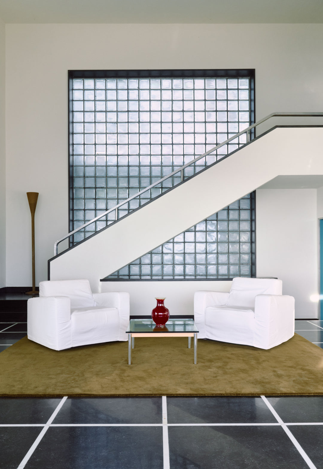 Layered hand-knotted rug in a sitting room